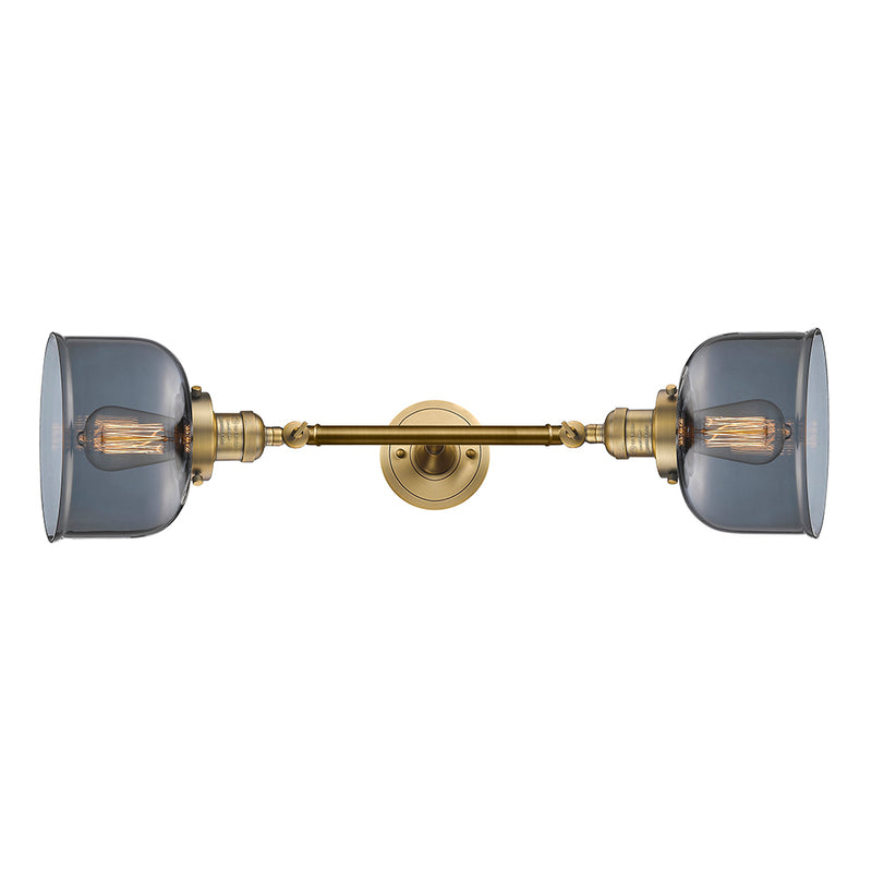 Bell Bath Vanity Light shown in the Brushed Brass finish with a Plated Smoke shade