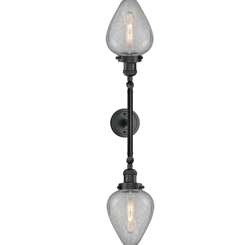 Geneseo Bath Vanity Light shown in the Matte Black finish with a Clear Crackled shade