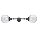 Beacon Bath Vanity Light shown in the Matte Black finish with a Seedy shade