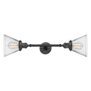 Cone Bath Vanity Light shown in the Oil Rubbed Bronze finish with a Clear shade