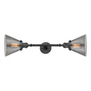 Cone Bath Vanity Light shown in the Oil Rubbed Bronze finish with a Plated Smoke shade