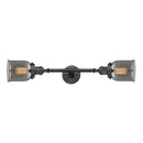 Bell Bath Vanity Light shown in the Oil Rubbed Bronze finish with a Plated Smoke shade