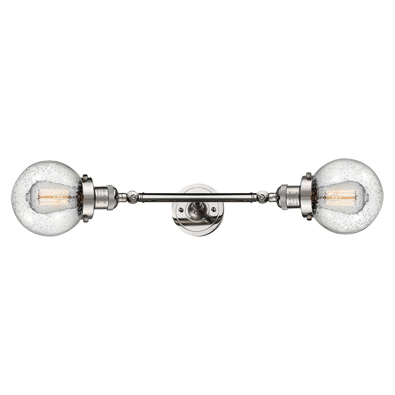 Beacon Bath Vanity Light shown in the Polished Nickel finish with a Seedy shade