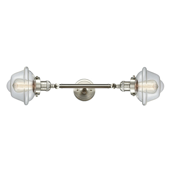 Oxford Bath Vanity Light shown in the Brushed Satin Nickel finish with a Clear shade