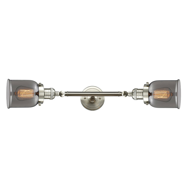 Bell Bath Vanity Light shown in the Brushed Satin Nickel finish with a Plated Smoke shade