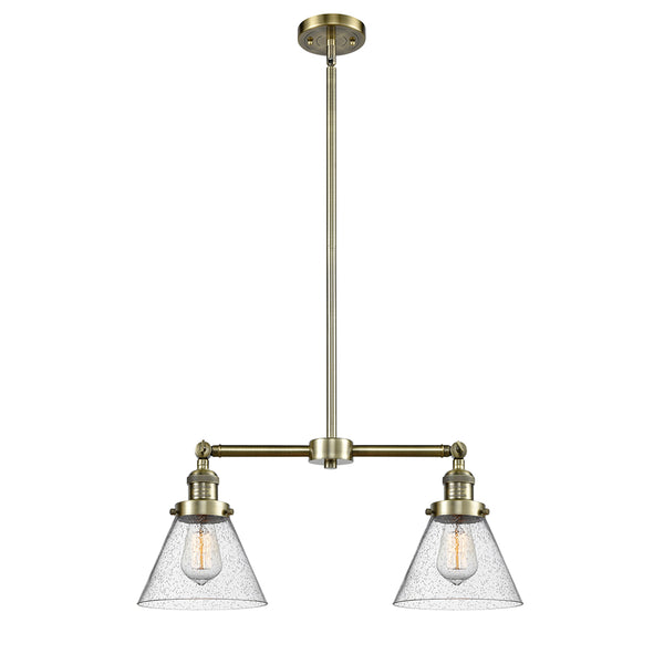 Cone Island Light shown in the Antique Brass finish with a Seedy shade