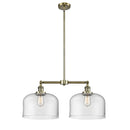 Bell Island Light shown in the Antique Brass finish with a Clear shade