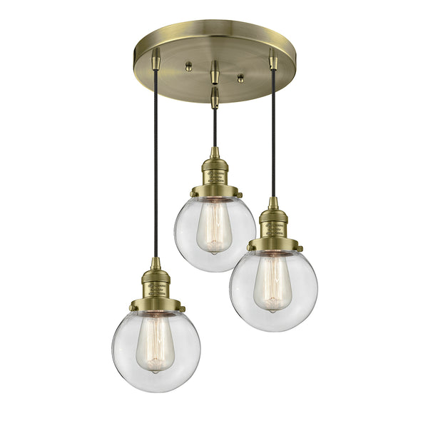 Beacon Multi-Pendant shown in the Antique Brass finish with a Clear shade