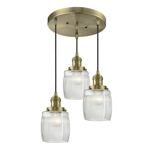 Colton Multi-Pendant shown in the Antique Brass finish with a Clear Halophane shade