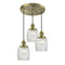 Colton Multi-Pendant shown in the Antique Brass finish with a Clear Halophane shade