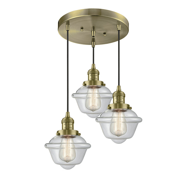 Oxford Multi-Pendant shown in the Antique Brass finish with a Clear shade