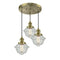 Oxford Multi-Pendant shown in the Antique Brass finish with a Seedy shade