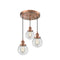 Beacon Multi-Pendant shown in the Antique Copper finish with a Clear shade