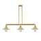 Halophane Island Light shown in the Satin Gold finish with a Clear Halophane shade