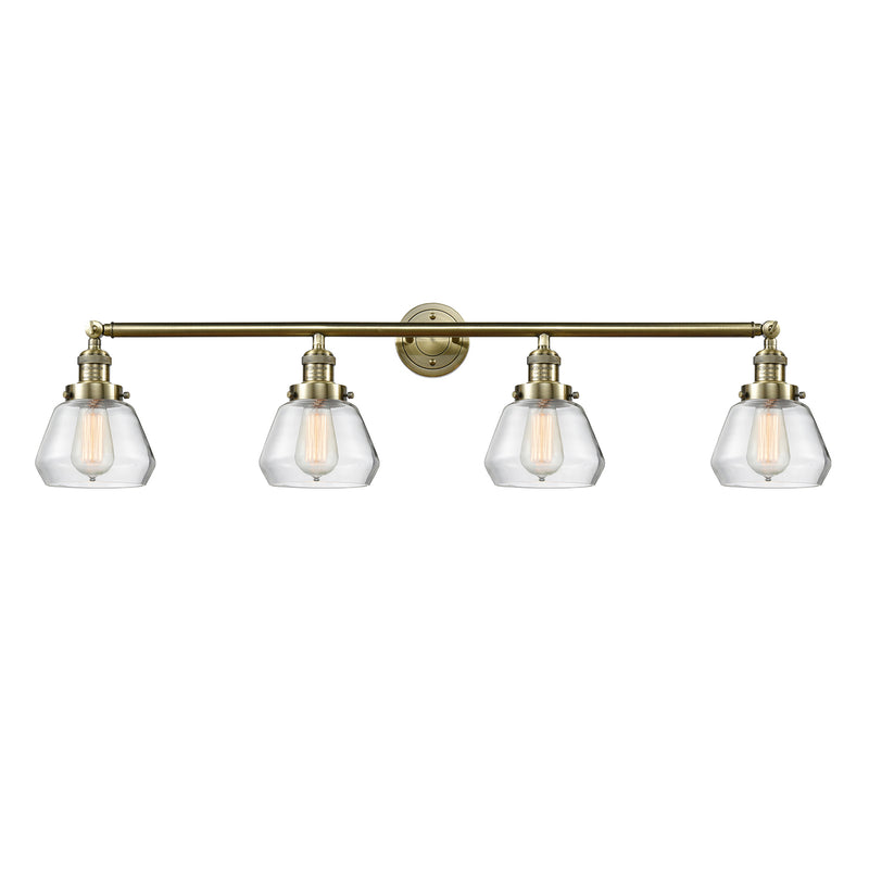 Fulton Bath Vanity Light shown in the Antique Brass finish with a Clear shade