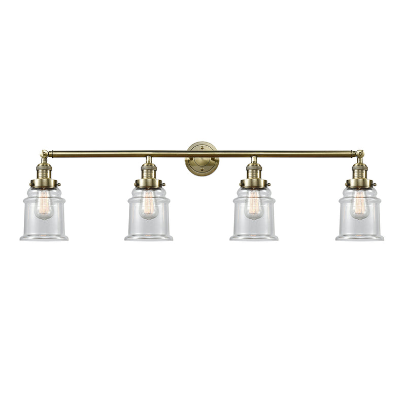 Canton Bath Vanity Light shown in the Antique Brass finish with a Clear shade