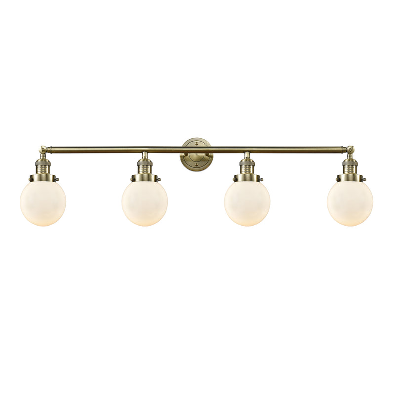 Beacon Bath Vanity Light shown in the Antique Brass finish with a Matte White shade