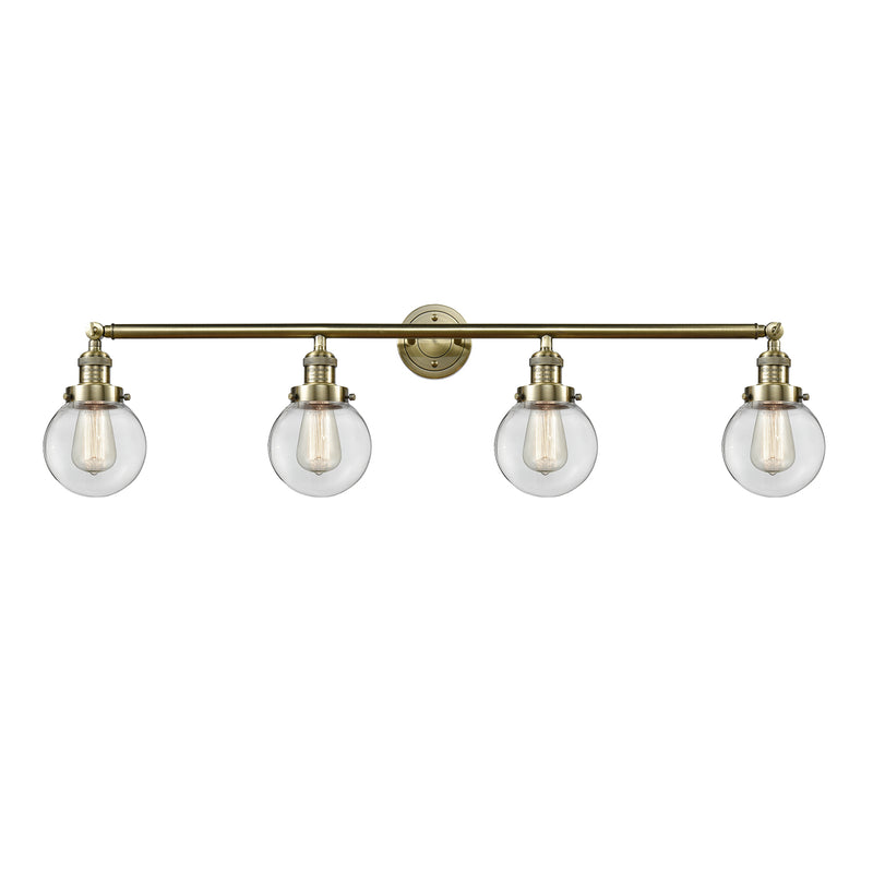 Beacon Bath Vanity Light shown in the Antique Brass finish with a Clear shade