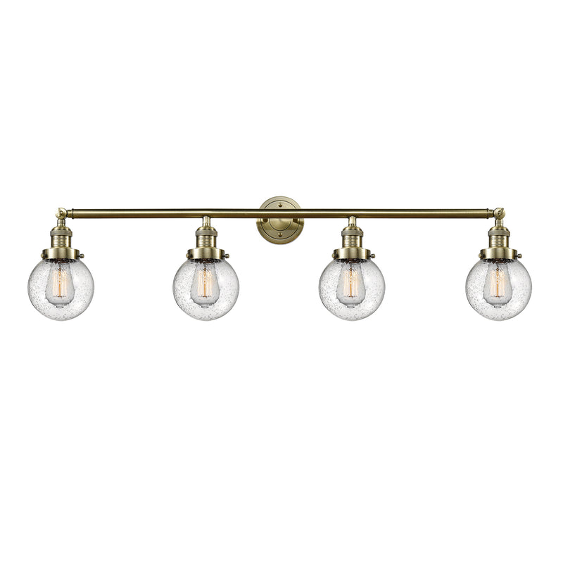 Beacon Bath Vanity Light shown in the Antique Brass finish with a Seedy shade