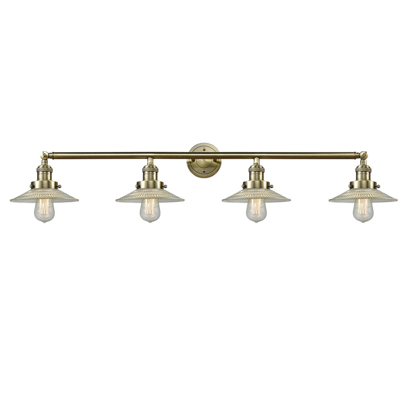 Halophane Bath Vanity Light shown in the Antique Brass finish with a Clear Halophane shade