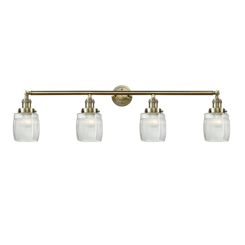 Colton Bath Vanity Light shown in the Antique Brass finish with a Clear Halophane shade