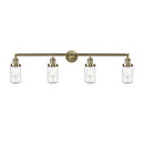 Dover Bath Vanity Light shown in the Antique Brass finish with a Seedy shade