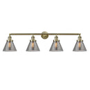 Cone Bath Vanity Light shown in the Antique Brass finish with a Plated Smoke shade