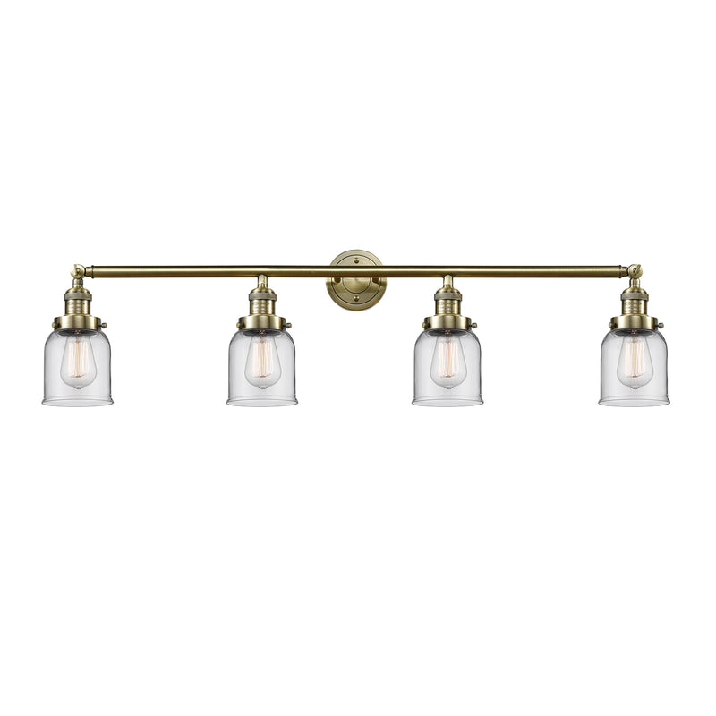 Bell Bath Vanity Light shown in the Antique Brass finish with a Clear shade
