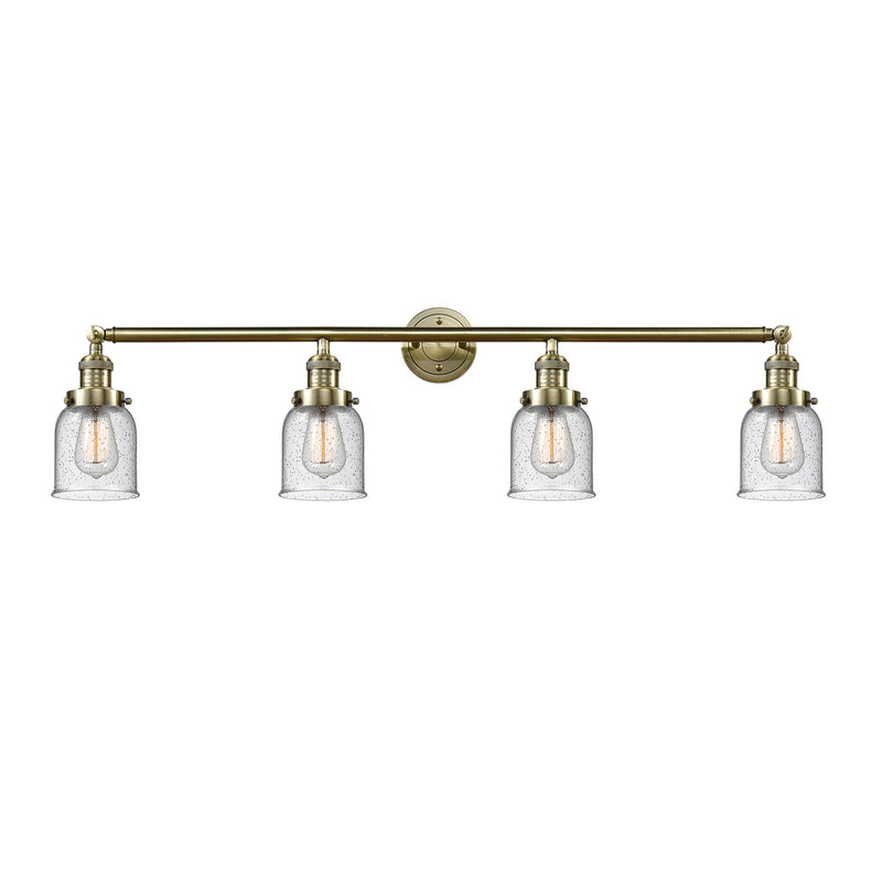 Bell Bath Vanity Light shown in the Antique Brass finish with a Seedy shade