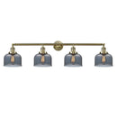 Bell Bath Vanity Light shown in the Antique Brass finish with a Plated Smoke shade