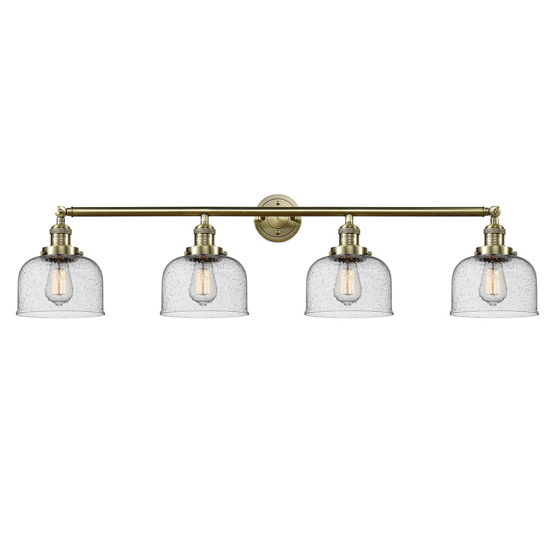 Bell Bath Vanity Light shown in the Antique Brass finish with a Seedy shade