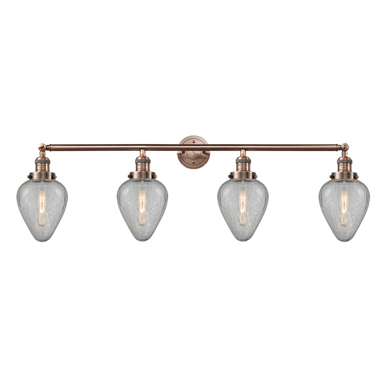 Geneseo Bath Vanity Light shown in the Antique Copper finish with a Clear Crackled shade
