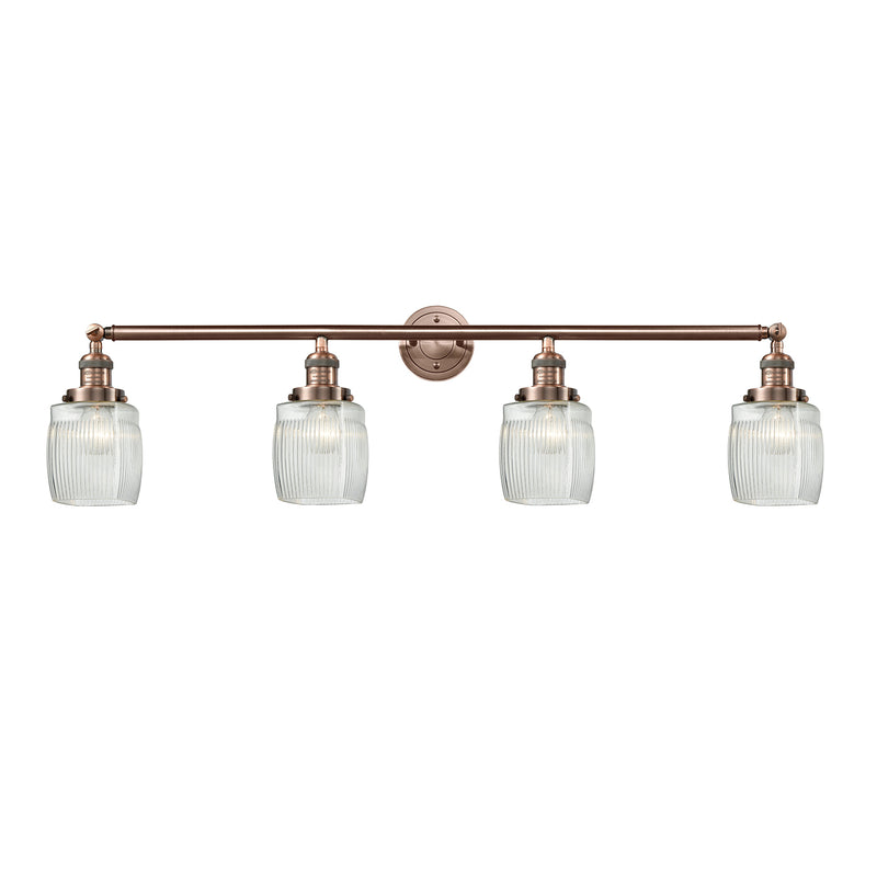 Colton Bath Vanity Light shown in the Antique Copper finish with a Clear Halophane shade