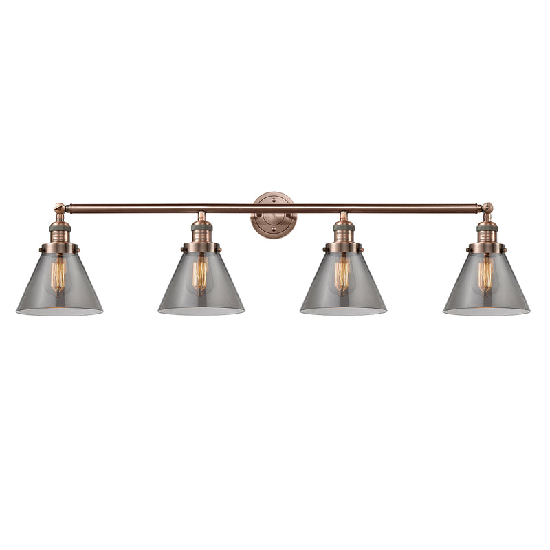Cone Bath Vanity Light shown in the Antique Copper finish with a Plated Smoke shade