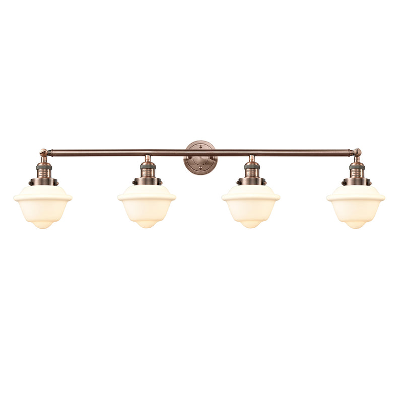 Oxford Bath Vanity Light shown in the Antique Copper finish with a Matte White shade