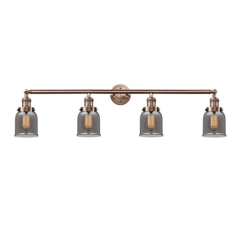 Bell Bath Vanity Light shown in the Antique Copper finish with a Plated Smoke shade