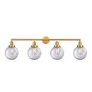 Beacon Bath Vanity Light shown in the Satin Gold finish with a Clear shade