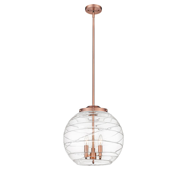 Deco Swirl Pendant shown in the Antique Copper finish with a Clear shade