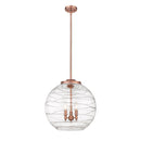 Deco Swirl Pendant shown in the Antique Copper finish with a Clear shade