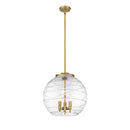 Deco Swirl Pendant shown in the Brushed Brass finish with a Clear shade