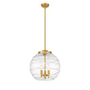 Deco Swirl Pendant shown in the Satin Gold finish with a Clear shade