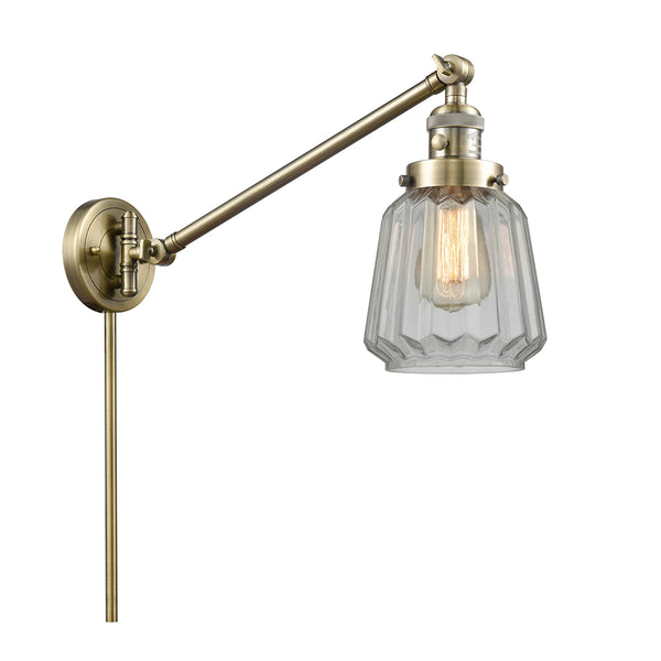 Chatham Swing Arm shown in the Antique Brass finish with a Clear shade
