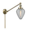 Geneseo Swing Arm shown in the Antique Brass finish with a Clear Crackled shade
