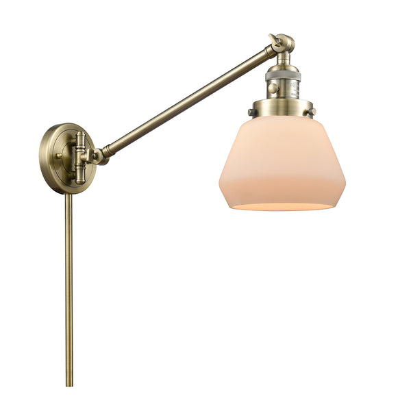 Fulton Swing Arm shown in the Antique Brass finish with a Matte White shade