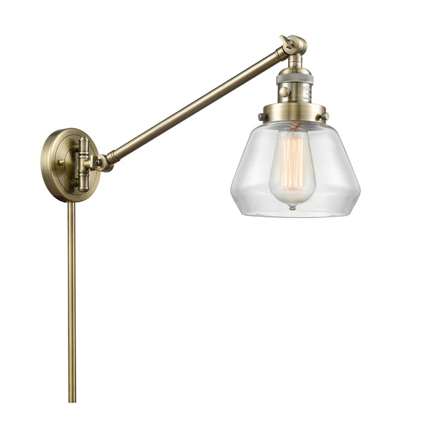 Fulton Swing Arm shown in the Antique Brass finish with a Clear shade
