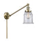 Canton Swing Arm shown in the Antique Brass finish with a Clear shade