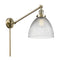 Seneca Falls Swing Arm shown in the Antique Brass finish with a Clear Halophane shade