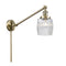 Colton Swing Arm shown in the Antique Brass finish with a Clear Halophane shade