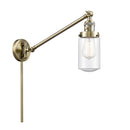 Dover Swing Arm shown in the Antique Brass finish with a Seedy shade