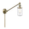 Dover Swing Arm shown in the Antique Brass finish with a Seedy shade
